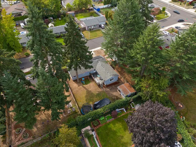 an aerial view of residential house with outdoor space and swimming pool