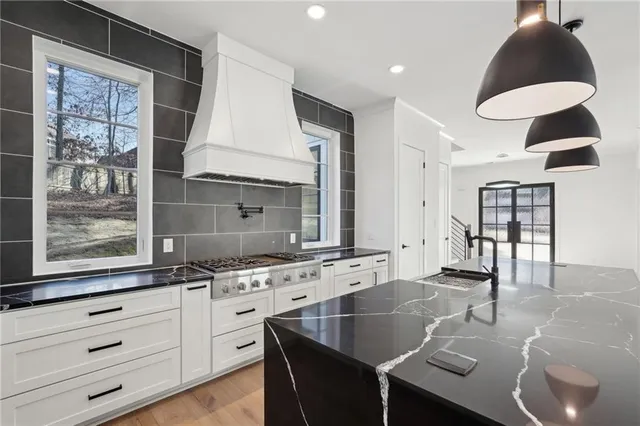a view of a room with wooden floor and a window