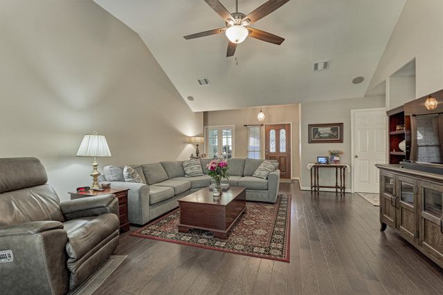 a view of a dining room and a chandelier