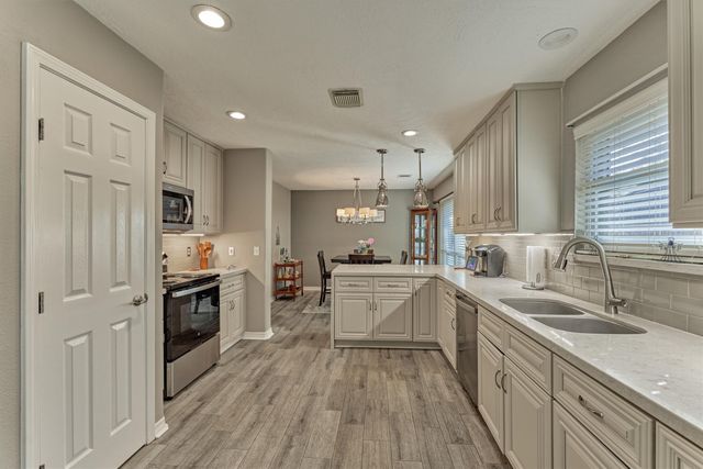 a view of backyard with tub and trees