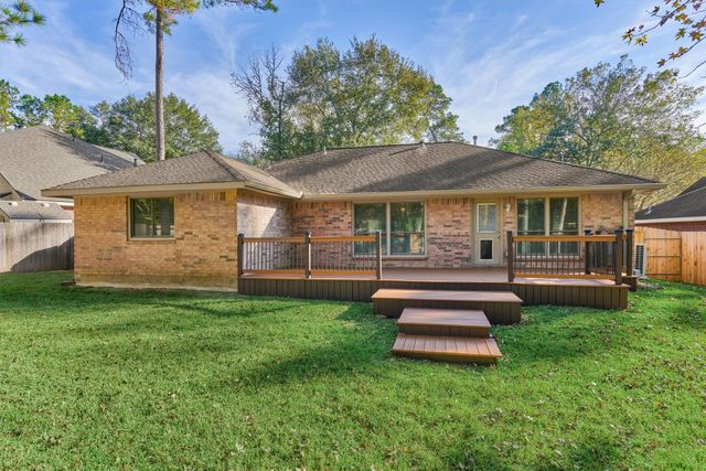 a group of people sitting in front of a store