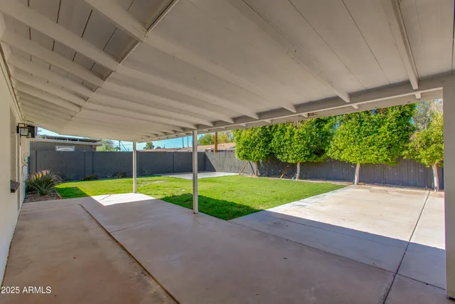 a view of yard with patio