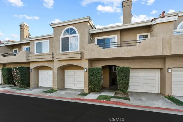a front view of a house with garage