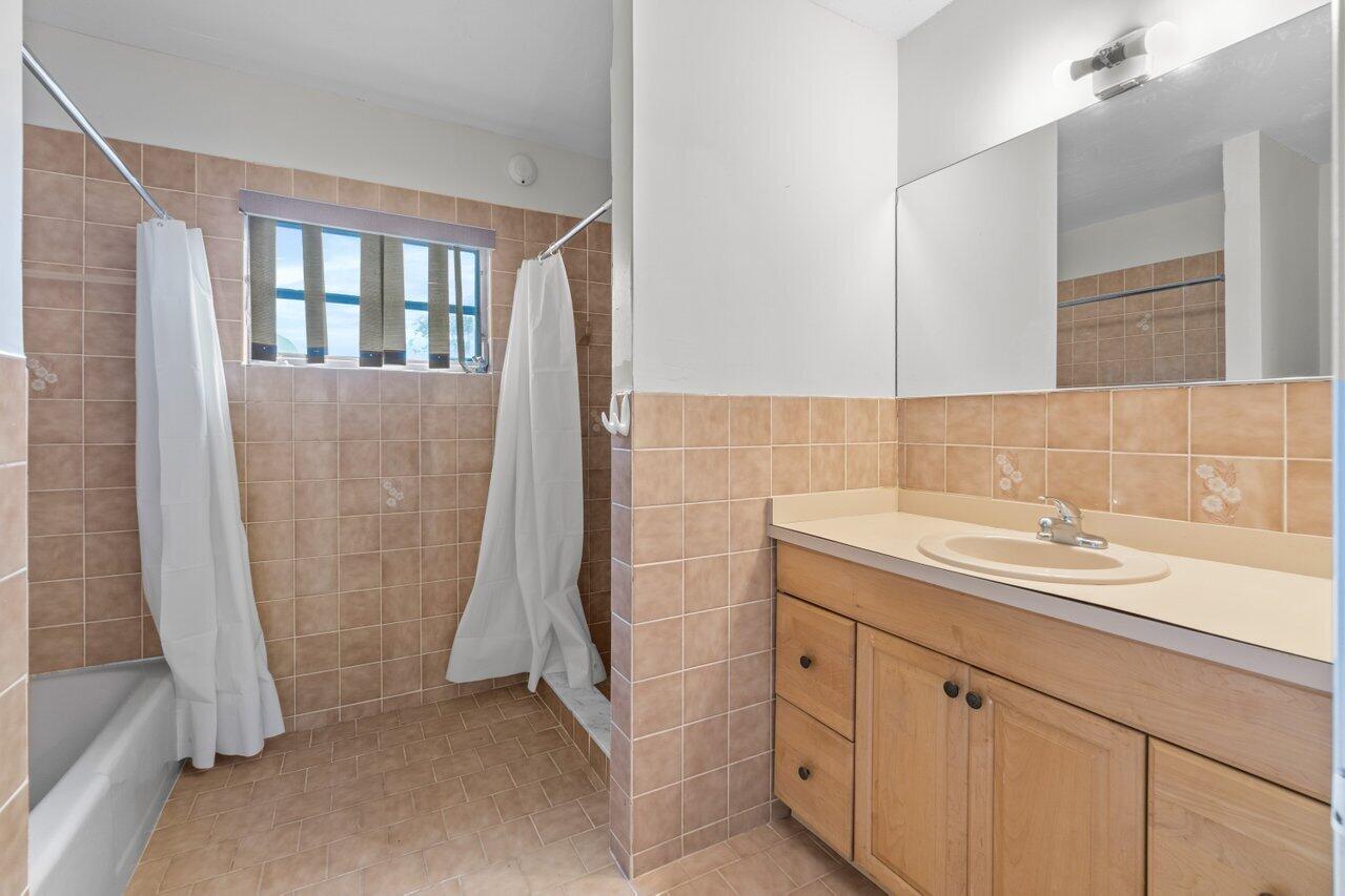 671 West 35th Street Riviera Beach, FL 33404 - Photo 16 of 27 Master bathroom with dual sinks