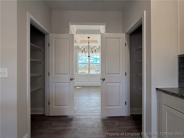 a kitchen with a sink and chandelier