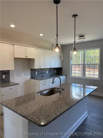 a living room with a fireplace with wooden floor