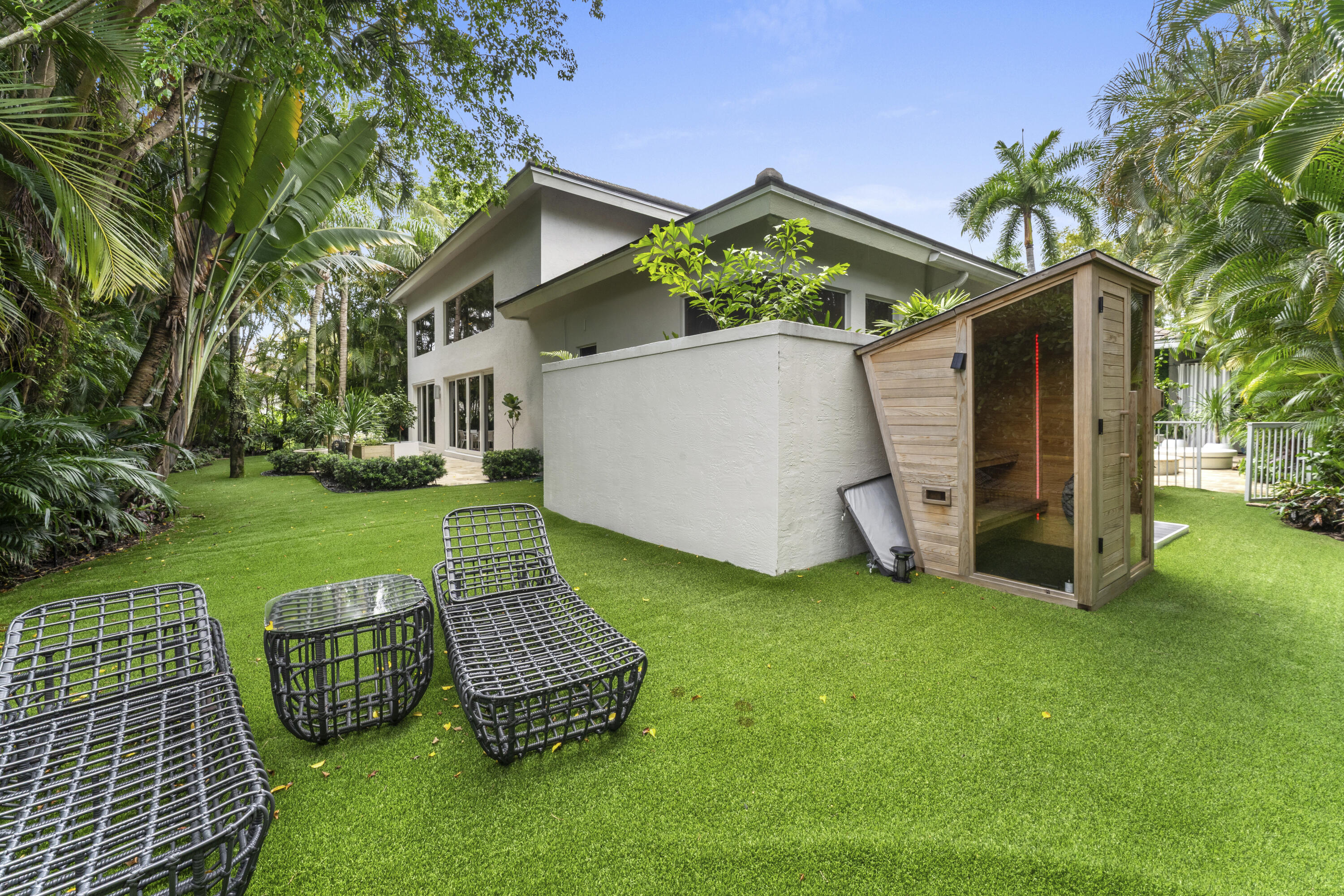 3156 Northwest 61st Street Boca Raton, FL 33496 - Photo 42 of 46 a front view of a house with garden