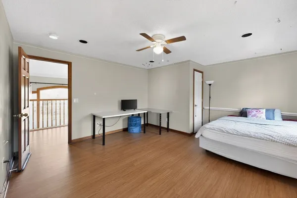 a bedroom with a bed and a desk