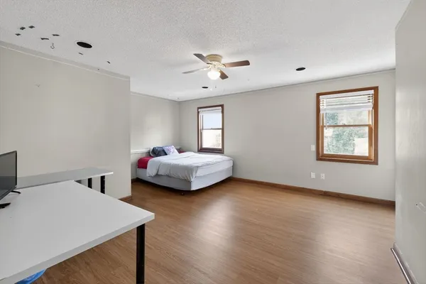 a bedroom with furniture and window