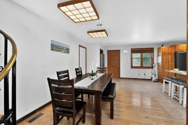a view of a dining room with furniture and a window