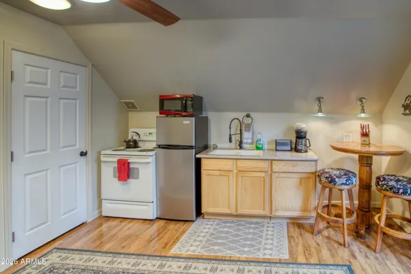 a utility room with cabinets washer and dryer