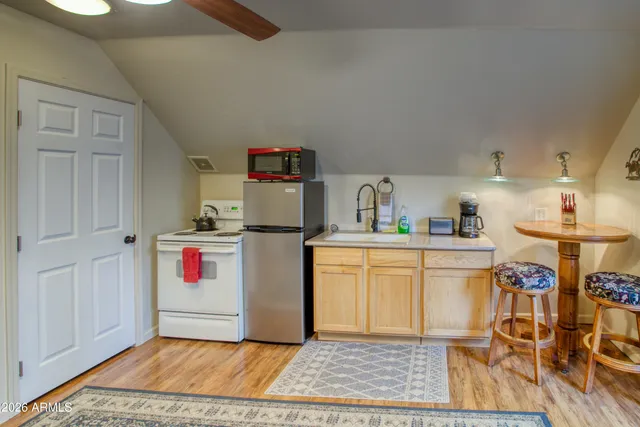 a utility room with cabinets washer and dryer