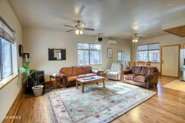 a living room with furniture or couch and a wooden floor