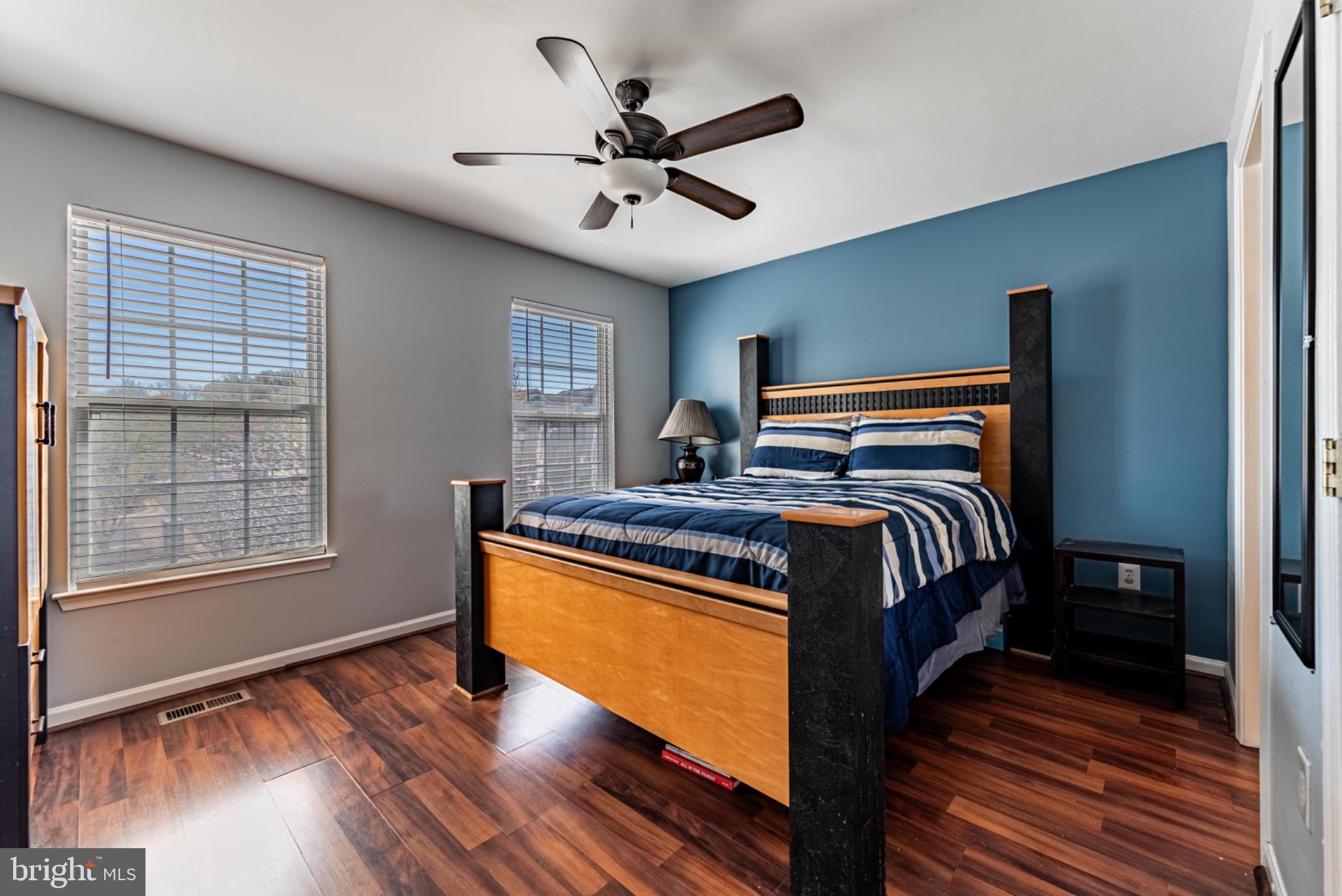60 6 Point Court Baltimore, MD 21244 - Photo 13 of 28 a bedroom with a bed and wooden floor