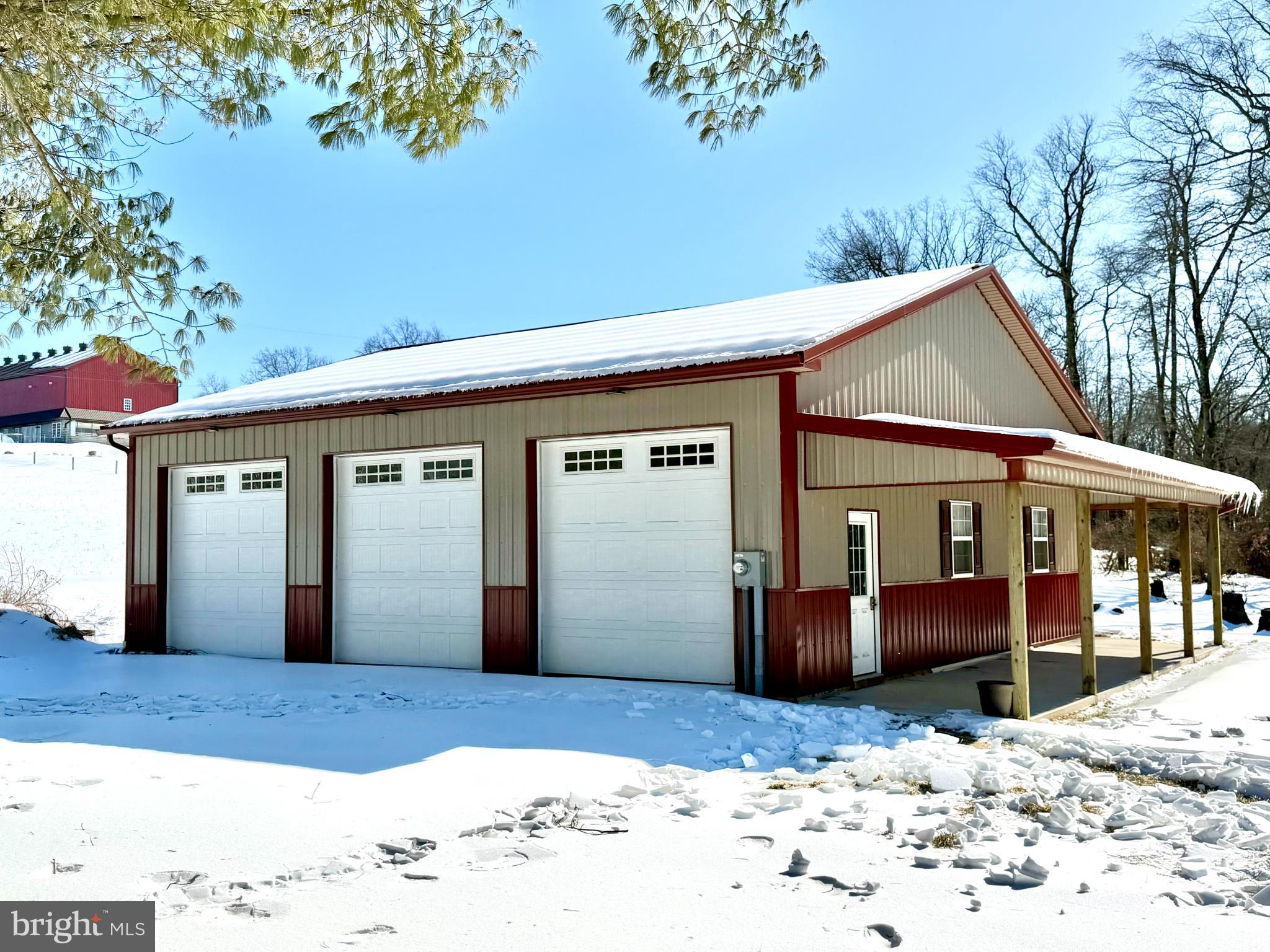 292 West Richardson Road Airville, PA 17302 - Photo 16 of 19 Charming garage nestled in a snowy landscape.