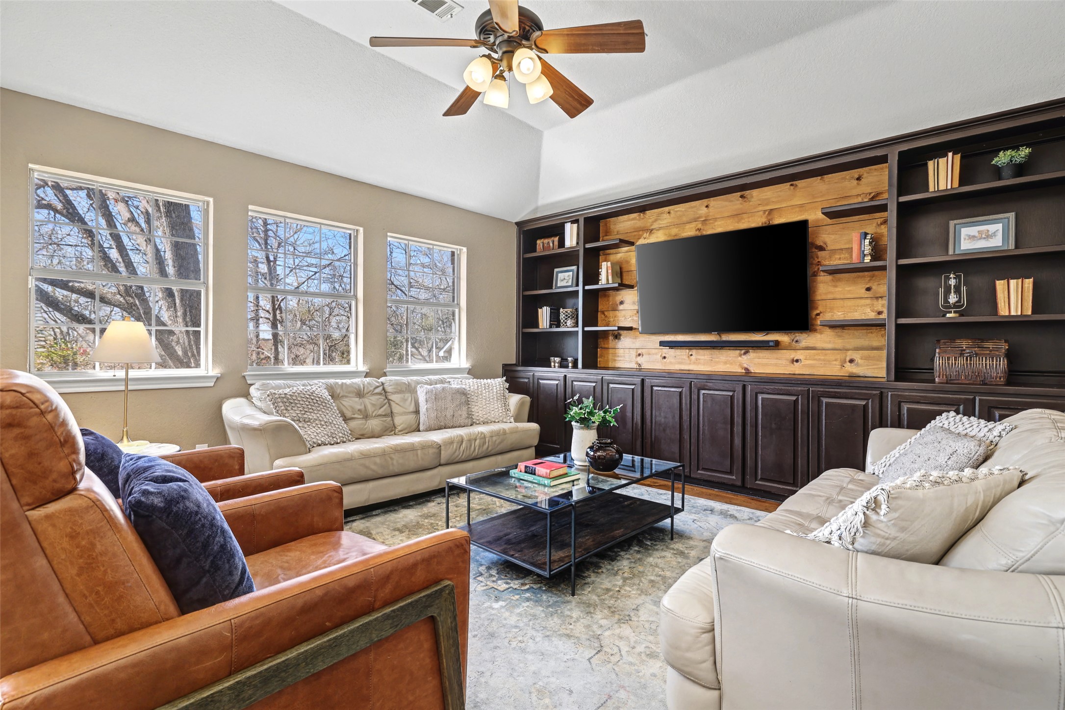 3022 Addie Lane Georgetown, TX 78628 - Photo 11 of 40 a living room with furniture and a flat screen tv
