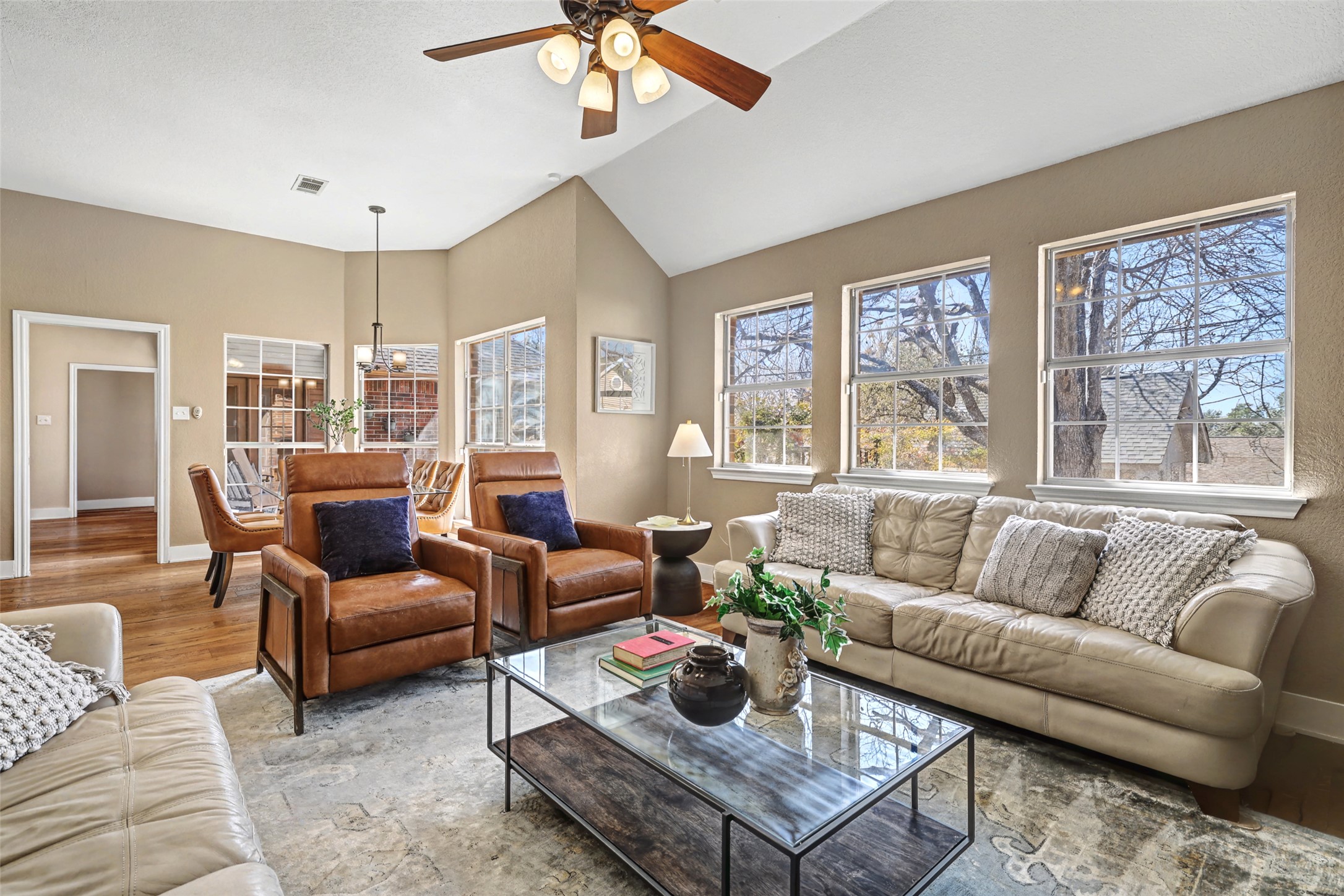 3022 Addie Lane Georgetown, TX 78628 - Photo 12 of 40 a living room with furniture a large window and a chandelier