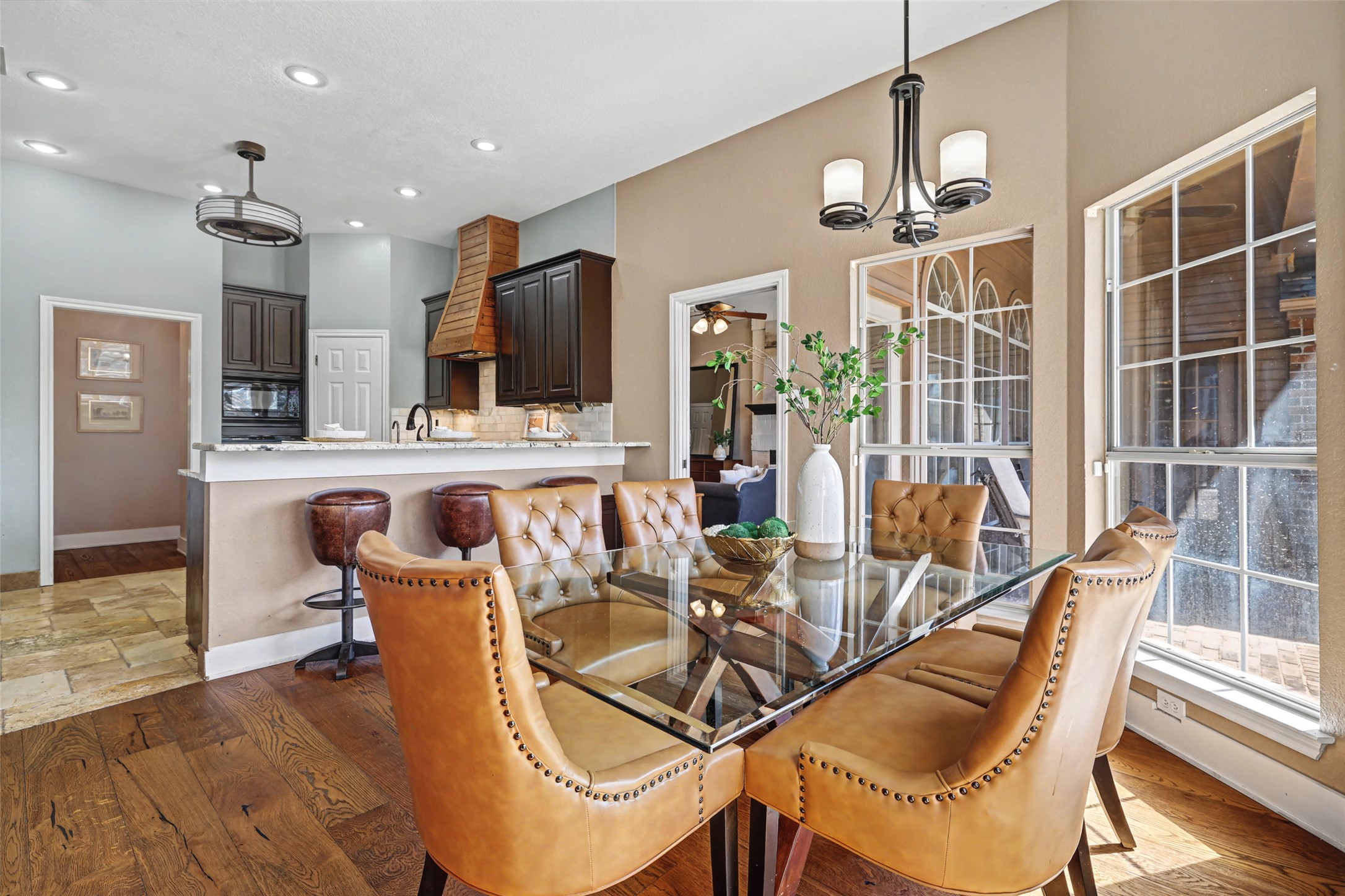 3022 Addie Lane Georgetown, TX 78628 - Photo 16 of 40 a view of a dining room with furniture a chandelier and wooden floor