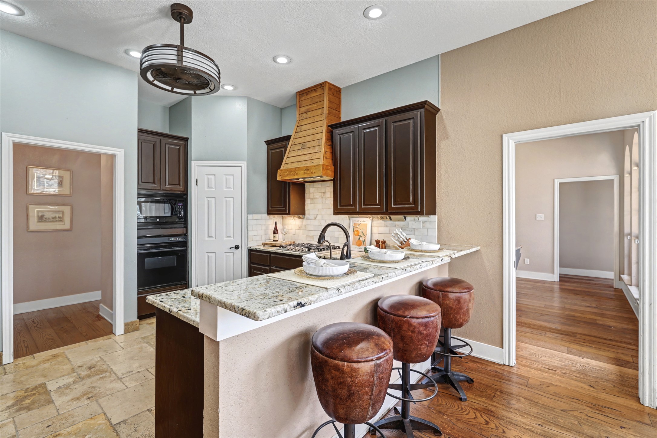 3022 Addie Lane Georgetown, TX 78628 - Photo 17 of 40 a kitchen with stainless steel appliances granite countertop a stove refrigerator and cabinets