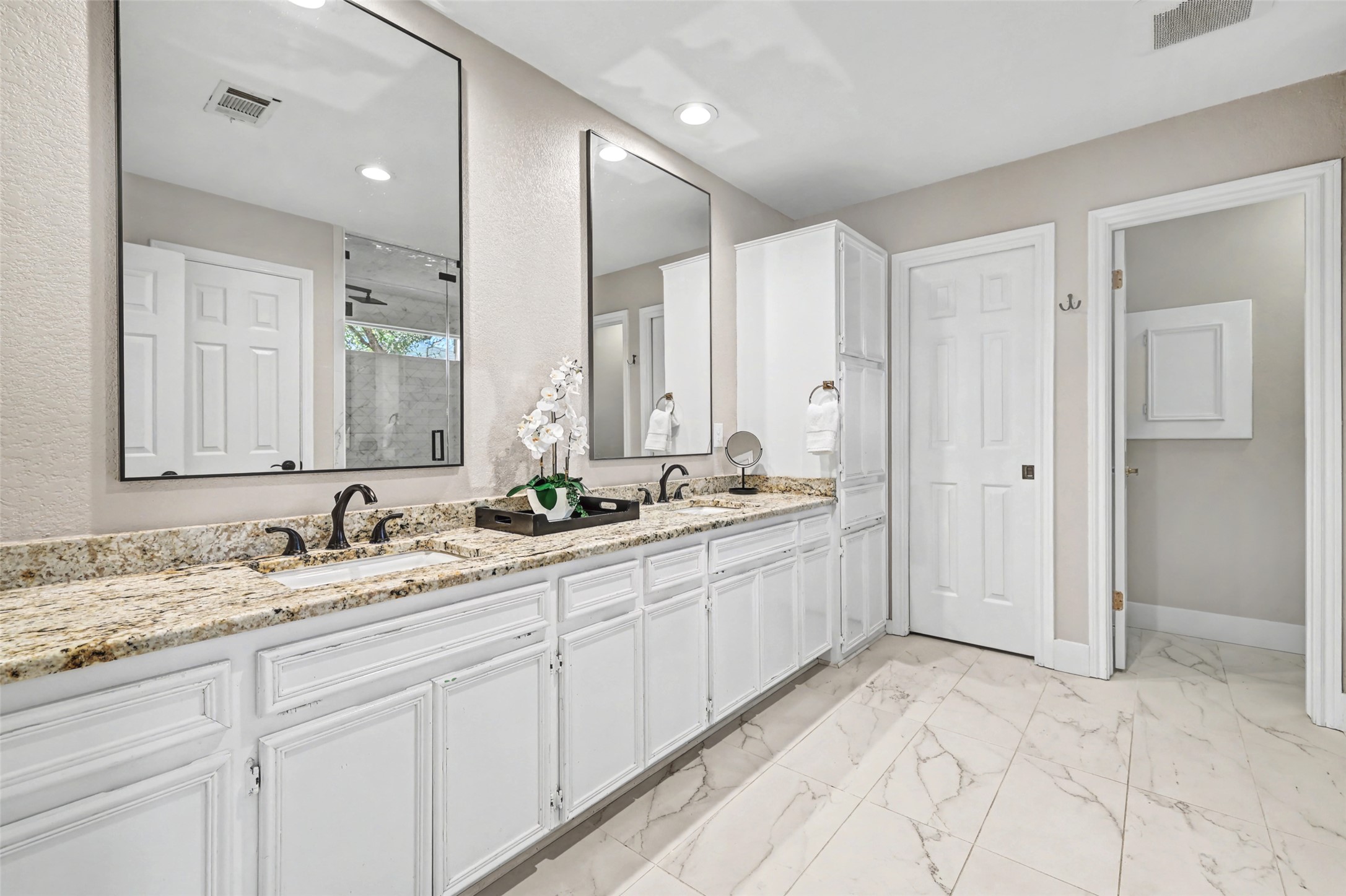 3022 Addie Lane Georgetown, TX 78628 - Photo 23 of 40 a spacious bathroom with a granite countertop sink and a mirror