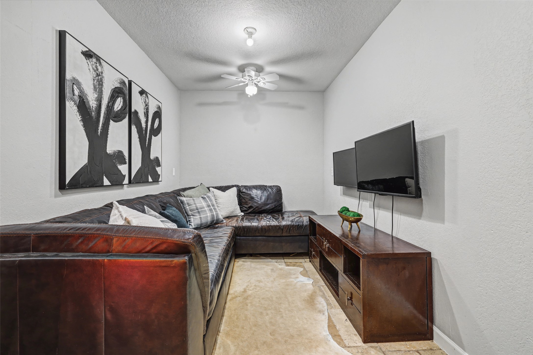3022 Addie Lane Georgetown, TX 78628 - Photo 30 of 40 a living room with furniture and a flat screen tv