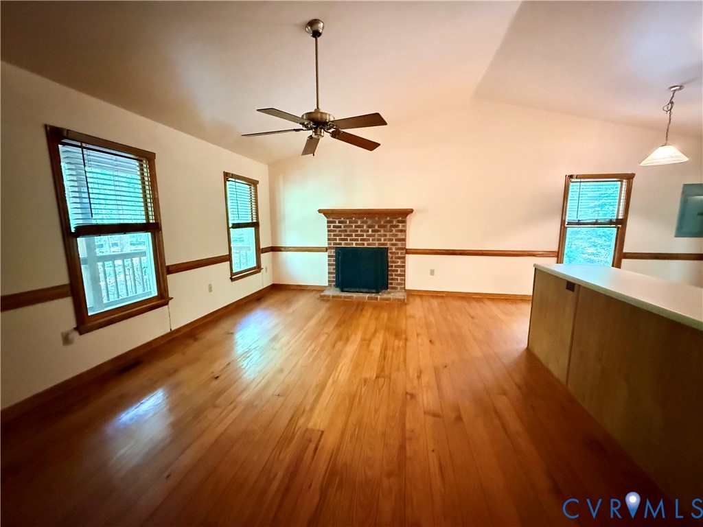 2590 Davis Mill Road Goochland, VA 23063 - Photo 5 of 33 a living room with a fireplace furniture and a wooden floor