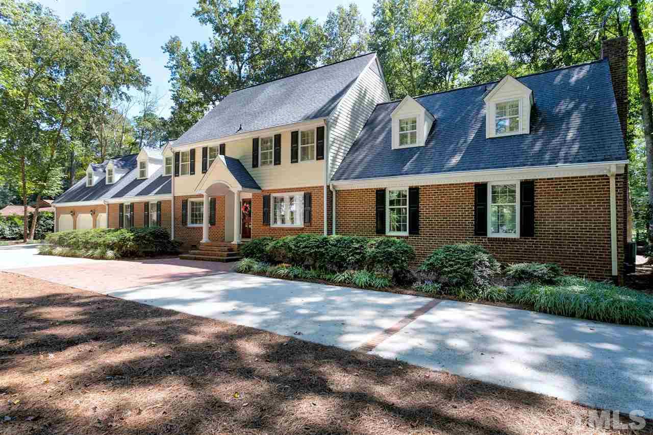305 Queensferry Road Cary, NC 27511 - Photo 2 of 28 a front view of a house with a yard