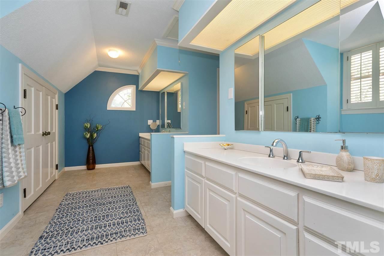 305 Queensferry Road Cary, NC 27511 - Photo 13 of 28 a spacious bathroom with a double vanity sink and a mirror