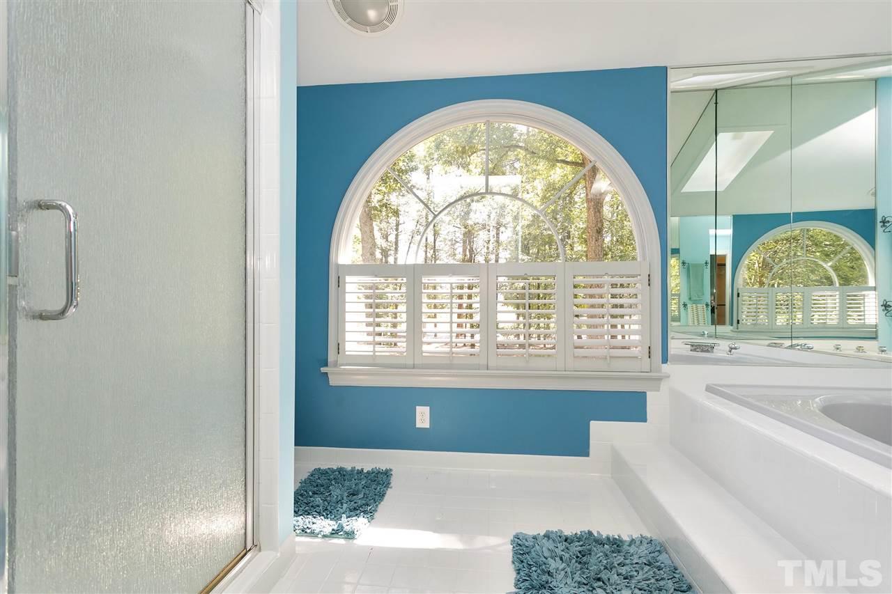 305 Queensferry Road Cary, NC 27511 - Photo 14 of 28 a living room with a large window and a swimming pool