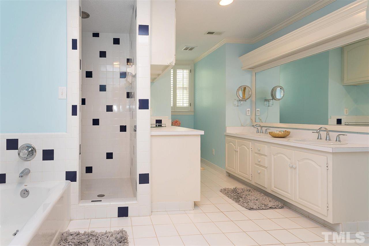 305 Queensferry Road Cary, NC 27511 - Photo 17 of 28 a spacious bathroom with a double vanity sink mirror and bathtub