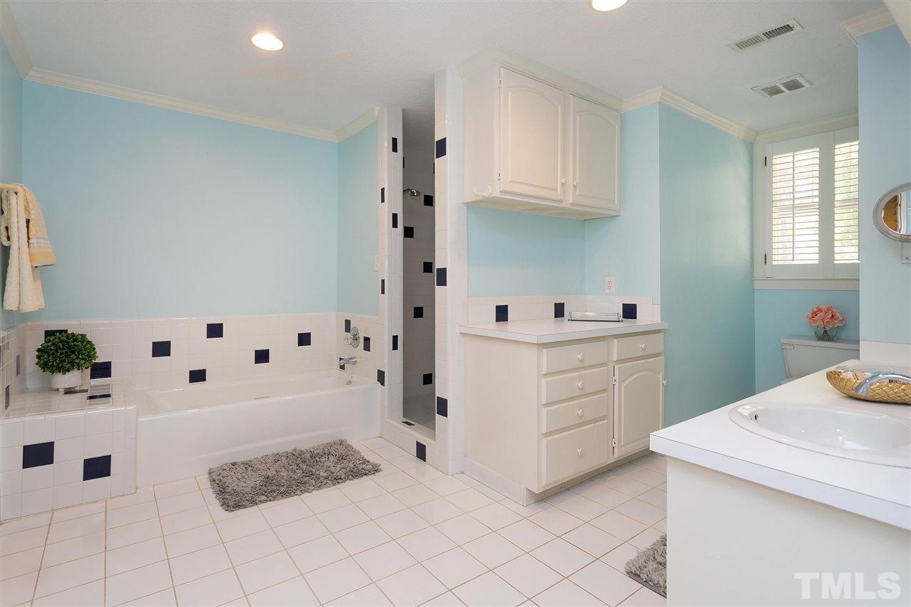 305 Queensferry Road Cary, NC 27511 - Photo 18 of 28 a room with white cabinets and window