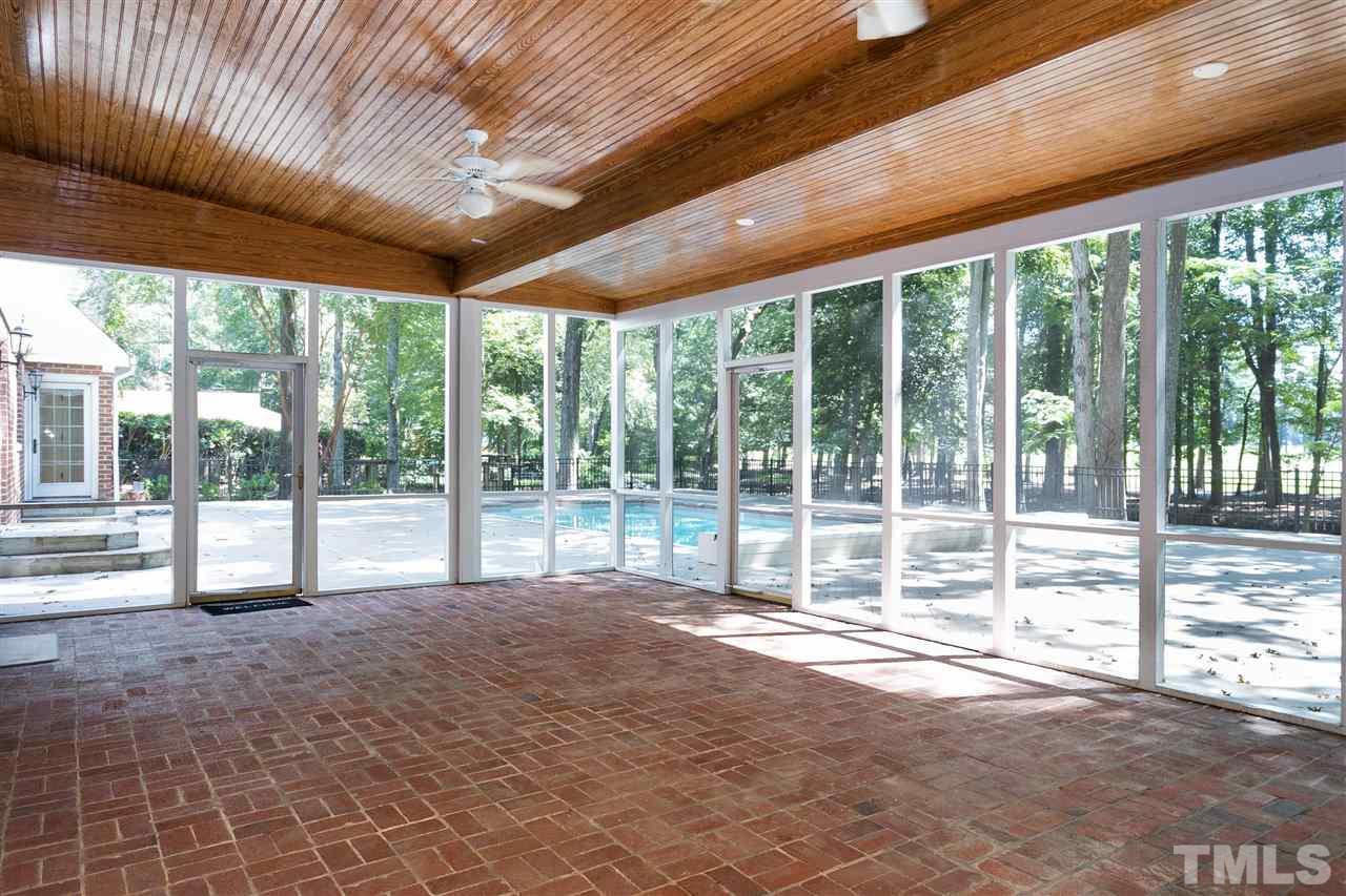 305 Queensferry Road Cary, NC 27511 - Photo 21 of 28 a swimming pool with large glass windows and outdoor seating