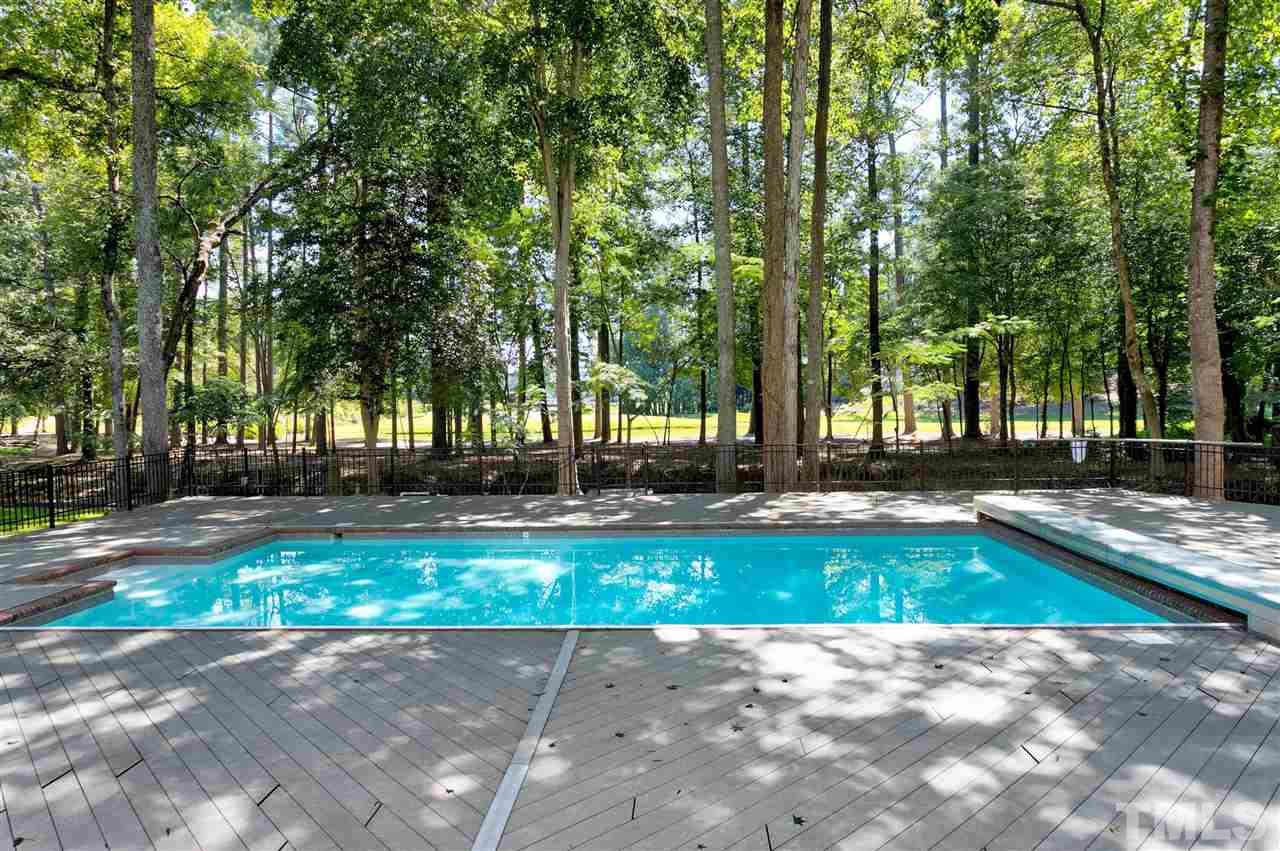 305 Queensferry Road Cary, NC 27511 - Photo 24 of 28 a view of swimming pool with sitting area and garden