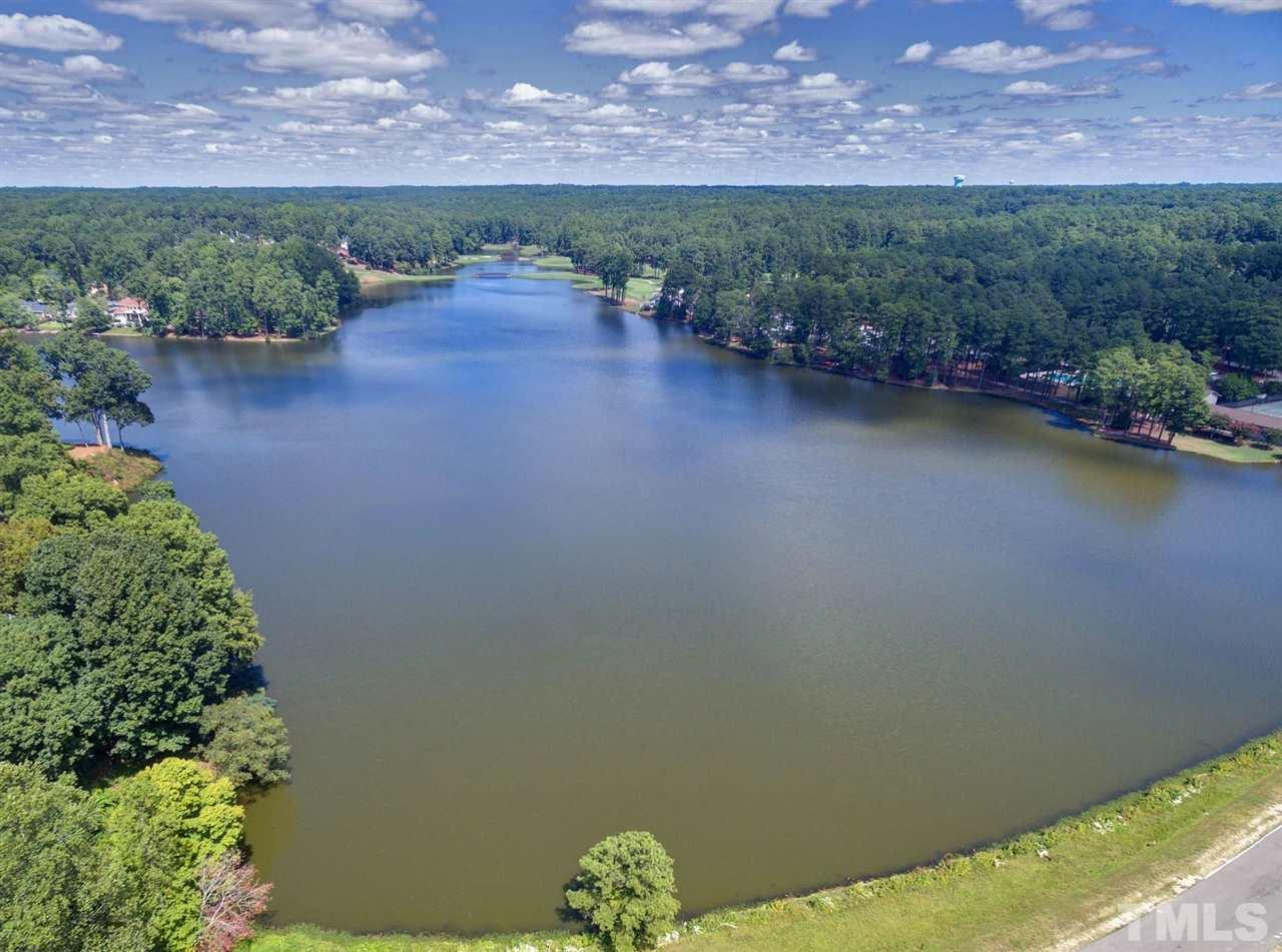 305 Queensferry Road Cary, NC 27511 - Photo 27 of 28 a view of a lake with a mountain in the background