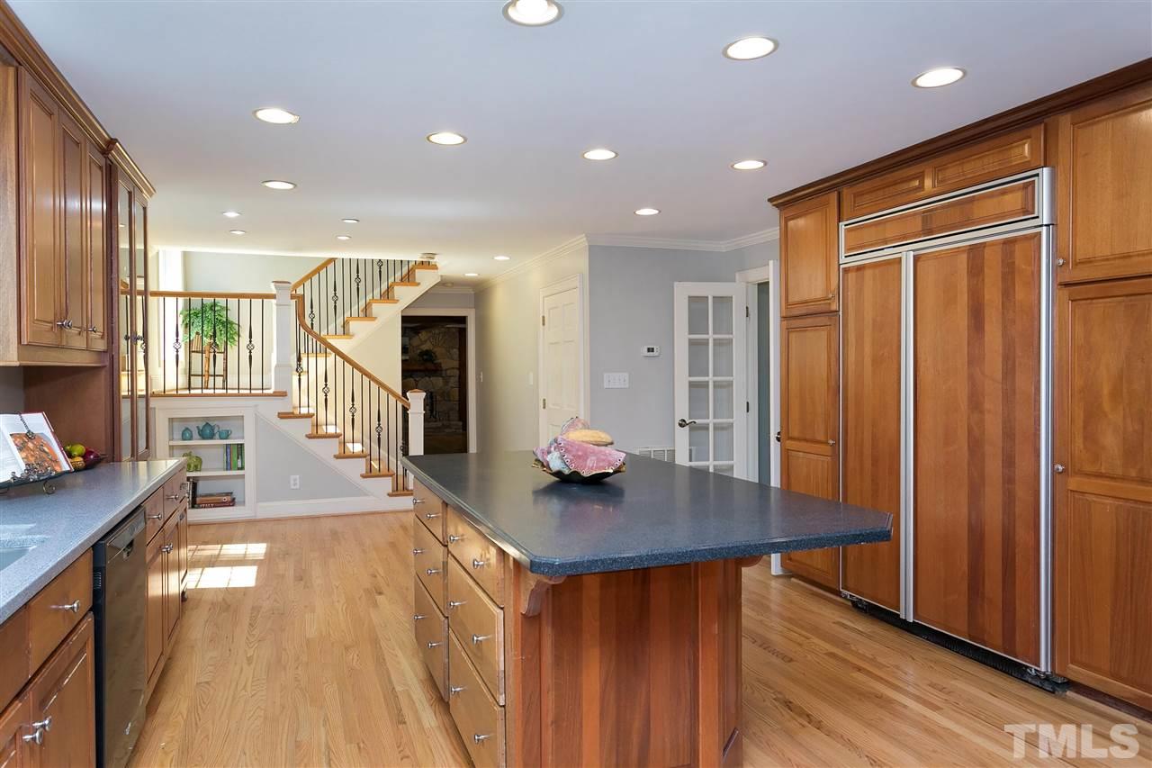 305 Queensferry Road Cary, NC 27511 - Photo 4 of 28 a dining hall with stainless steel appliances granite countertop a stove refrigerator and a view of living room