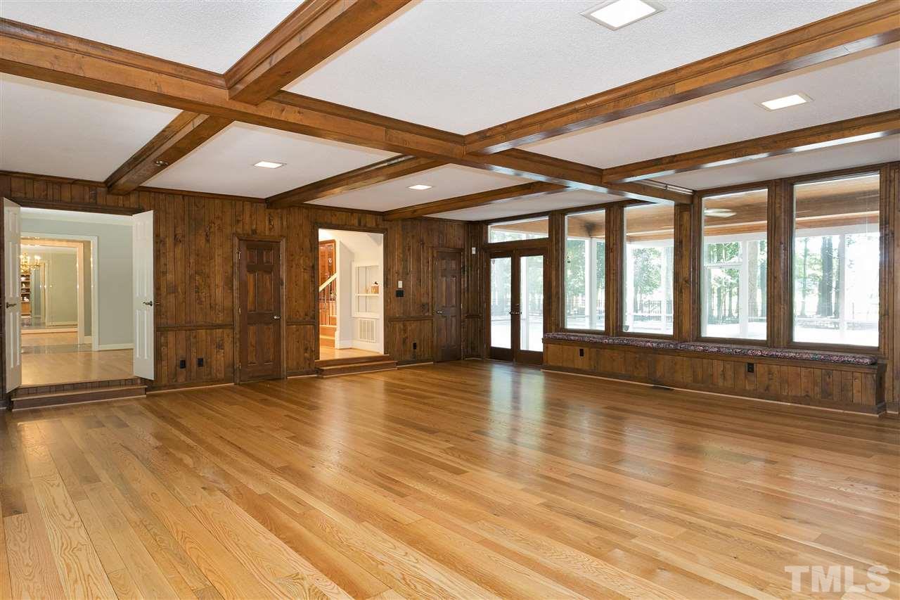 305 Queensferry Road Cary, NC 27511 - Photo 10 of 28 a view of an empty room with wooden floor and a window