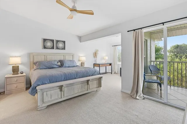 a bedroom with a bed and a lamp