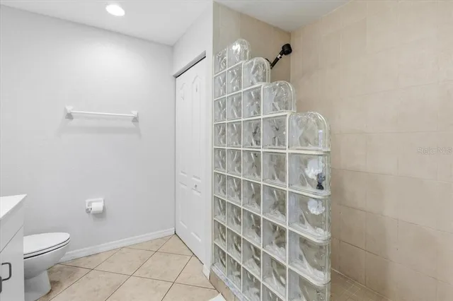 a bedroom with a bed and cupboard