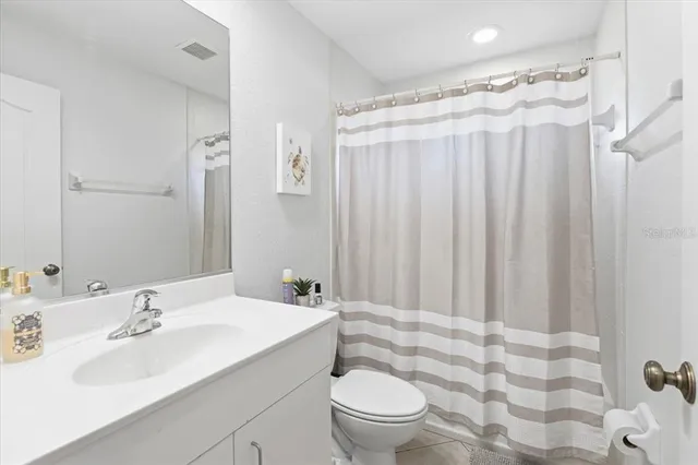 a bedroom with two beds and a window