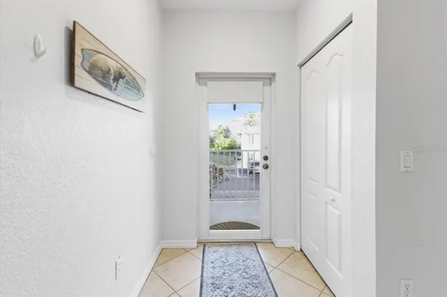 a living room with furniture a clock and a table