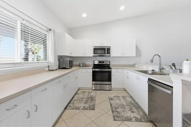 a kitchen with cabinets and sink