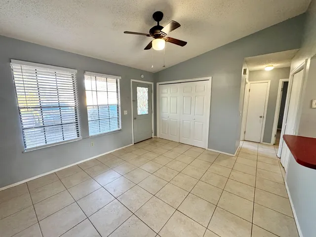 a view of an empty room with a window