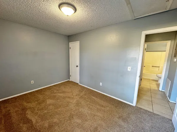 an empty room with a bathroom