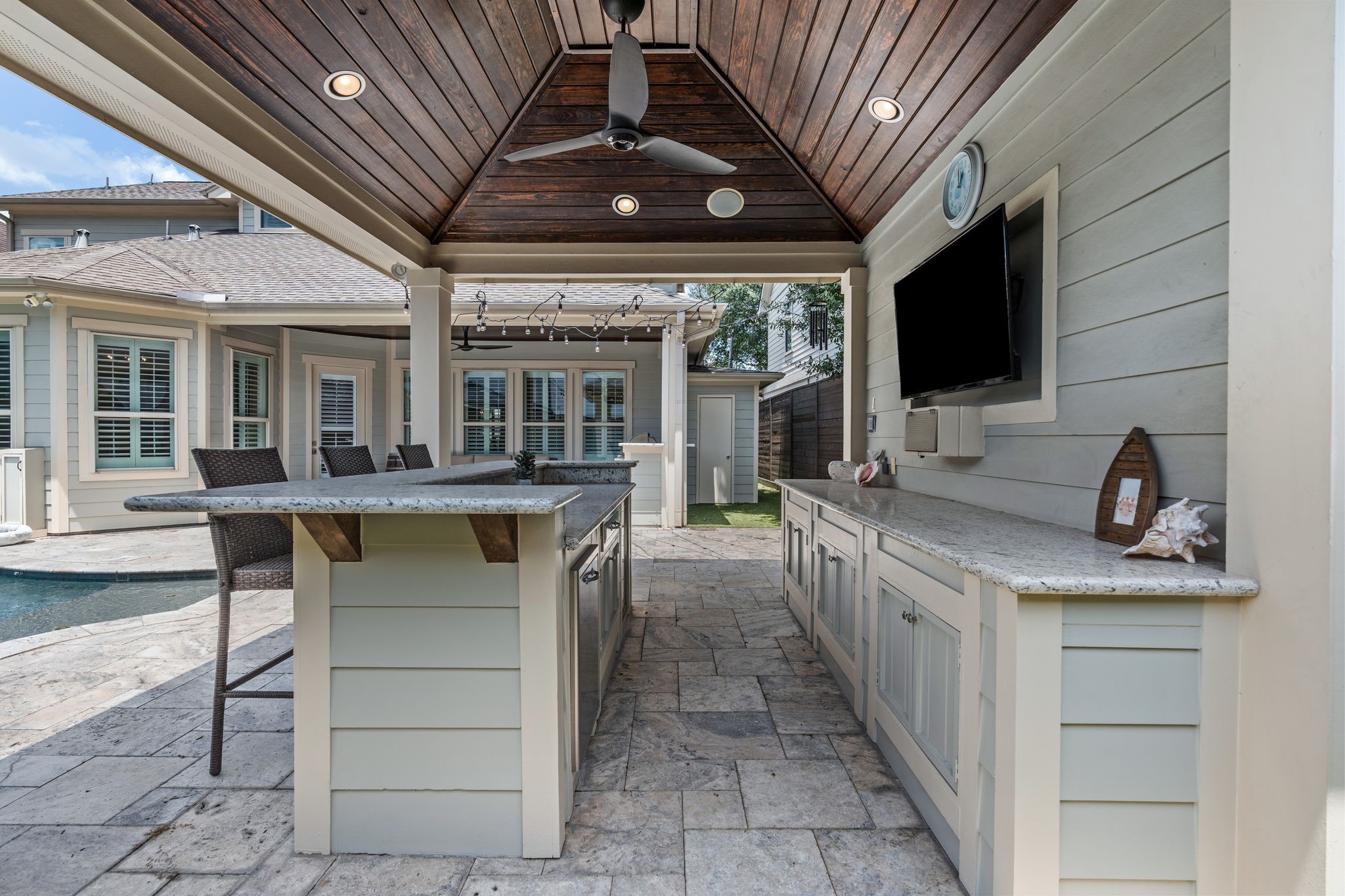 1217 Chippendale Road Houston, TX 77018 - Photo 36 of 42 Perfectly positioned alongside the pool & spa, the cabana offers an inviting place to gather, dine, or watch the game while enjoying the backyard. An outdoor TV, beverage refrigerator, bar seating, abundant storage, & built-in speakers provide exceptional functionality for entertaining.