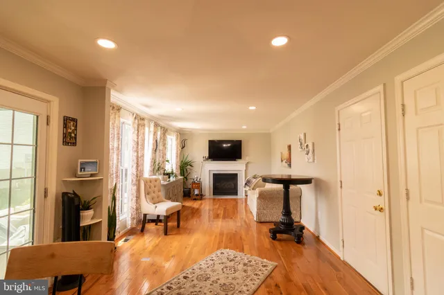 a view of a livingroom with furniture and a flat screen tv