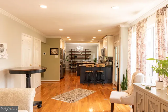 a view of a living room and kitchen with furniture