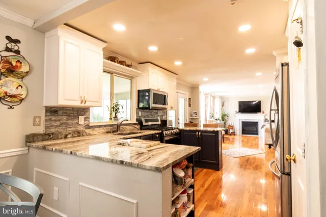 a view of a kitchen and dining room