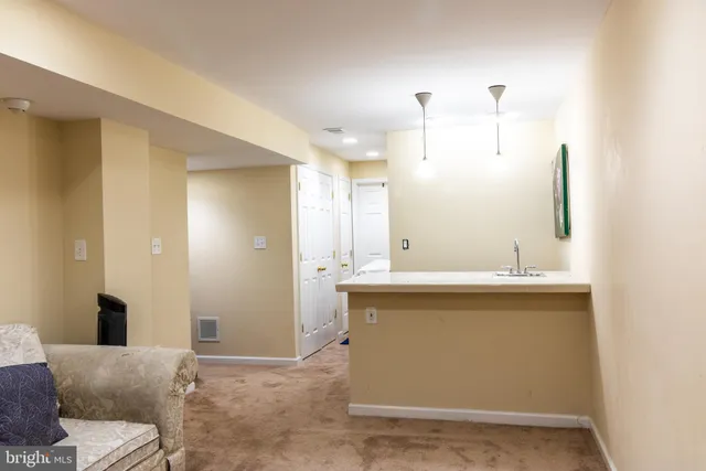 a view of living room with granite countertop furniture and fireplace