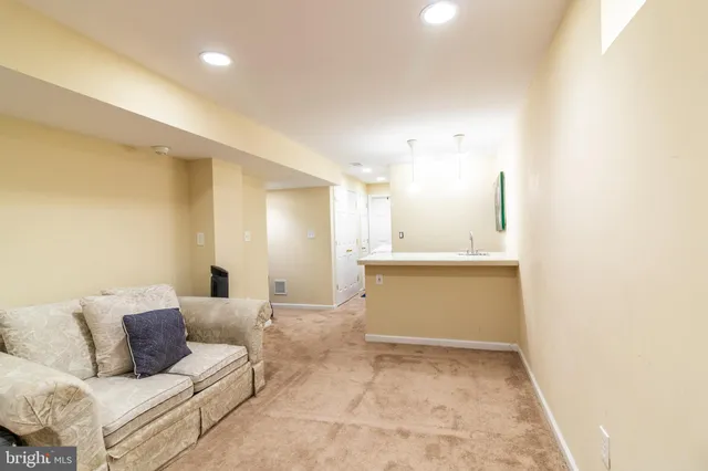 a living room with a couch and a view of living room