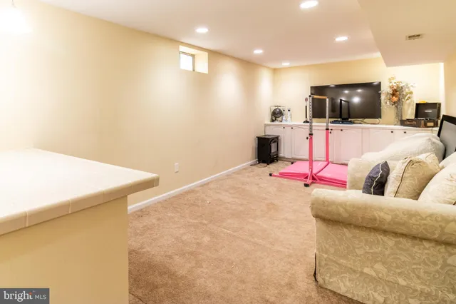 a living room with a couch and a flat screen tv
